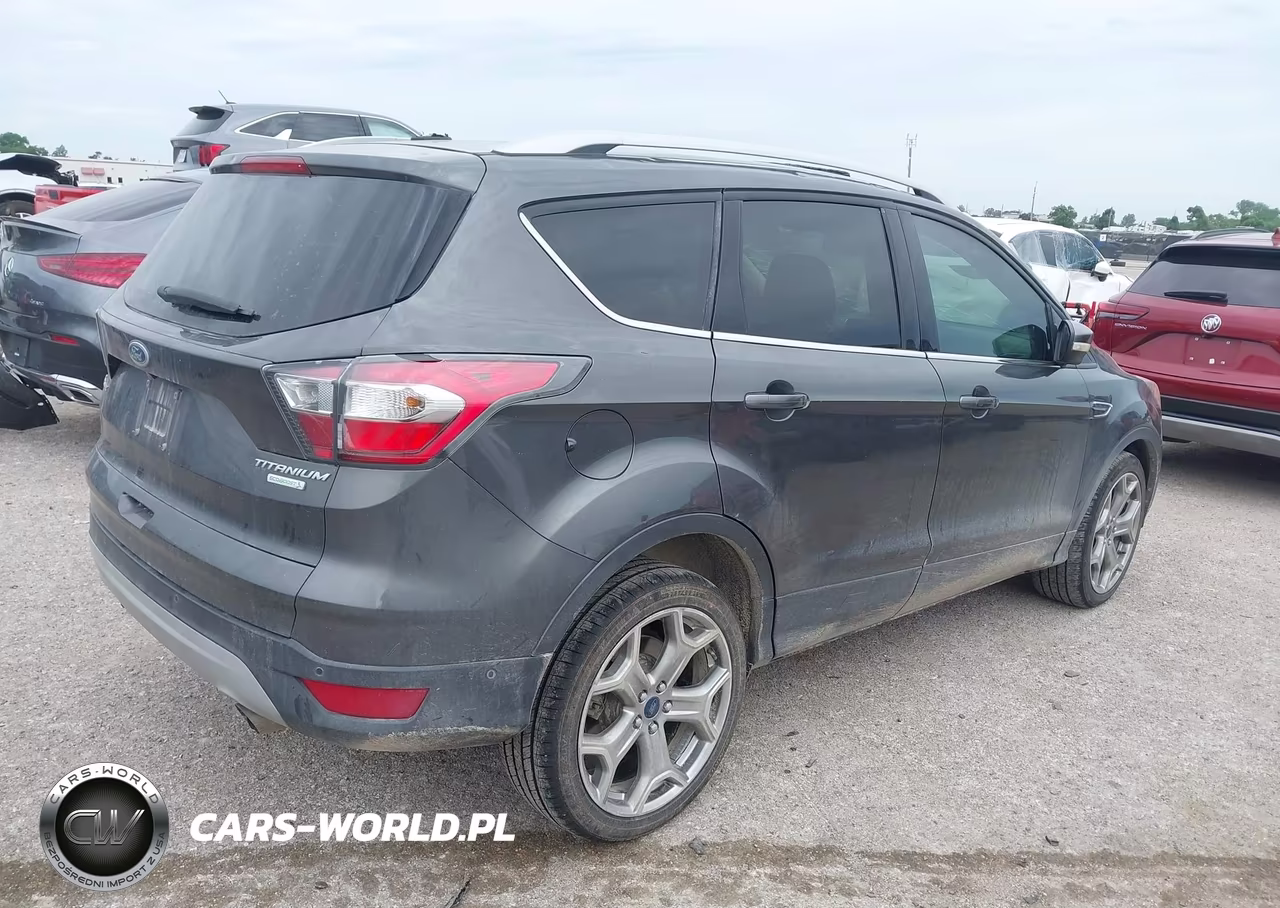 2017 Ford Escape Titanium VIN:1FMCU0J92HUA13329 - 4