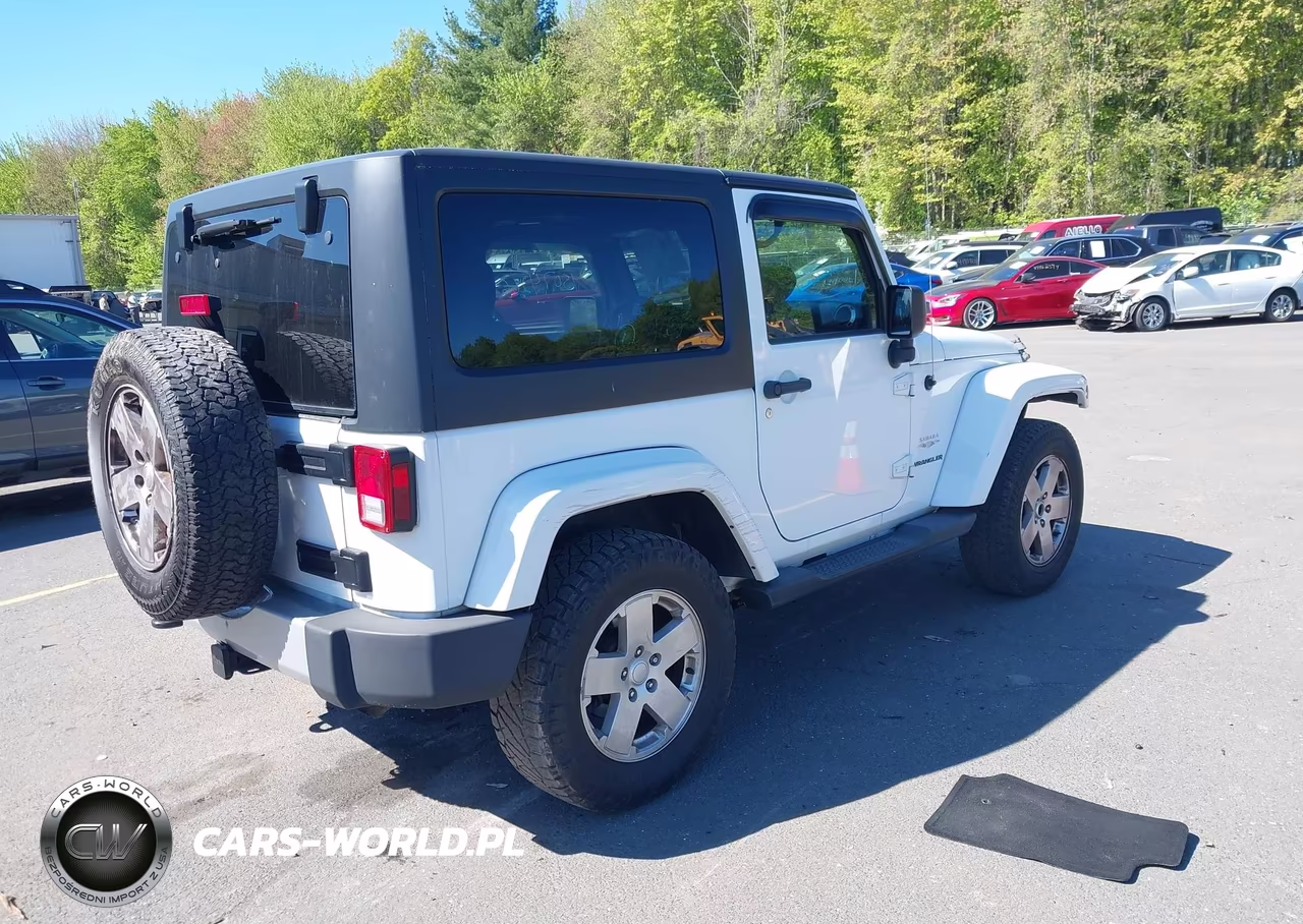 2011 Jeep Wrangler Sahara VIN:1J4AA5D14BL633159 - 4
