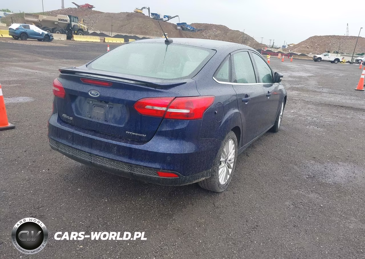 2017 Ford Focus Titanium VIN:1FADP3J20HL202559 - 4