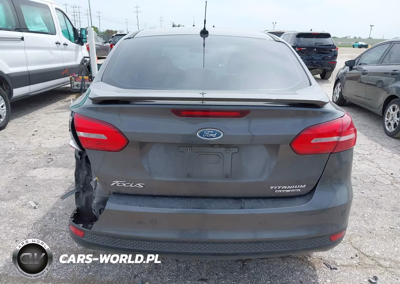 2015 Ford Focus Titanium VIN:1FADP3J21FL255199 - 16