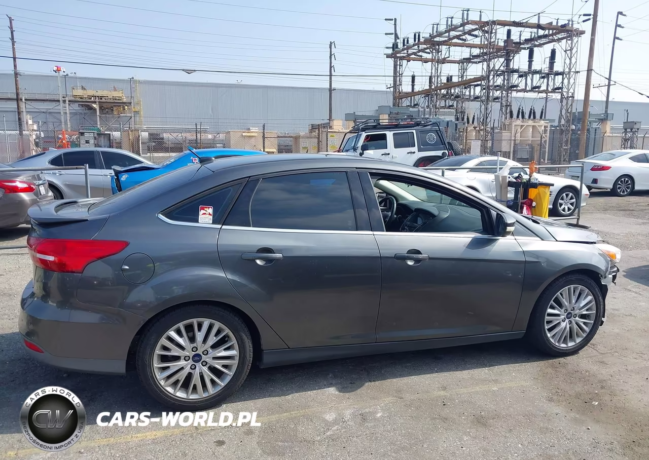2017 Ford Focus Titanium VIN:1FADP3J28HL245627 - 13