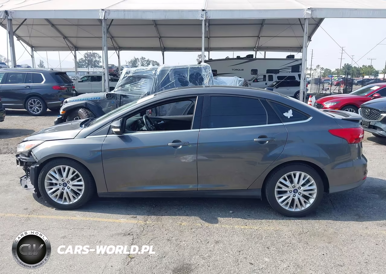 2017 Ford Focus Titanium VIN:1FADP3J28HL245627 - 14