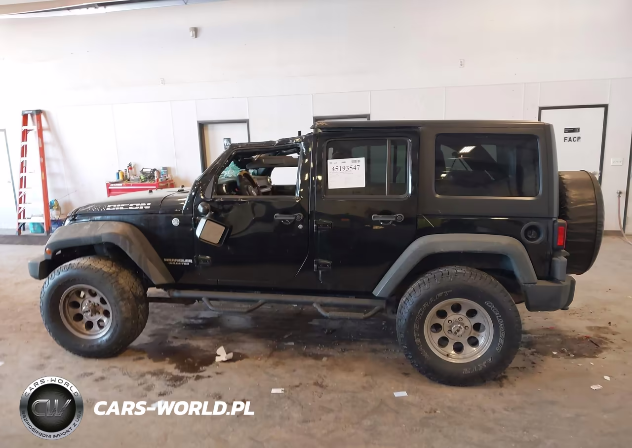 2011 Jeep Wrangler Unlimited Rubicon VIN:1J4BA6H14BL633733 - 14