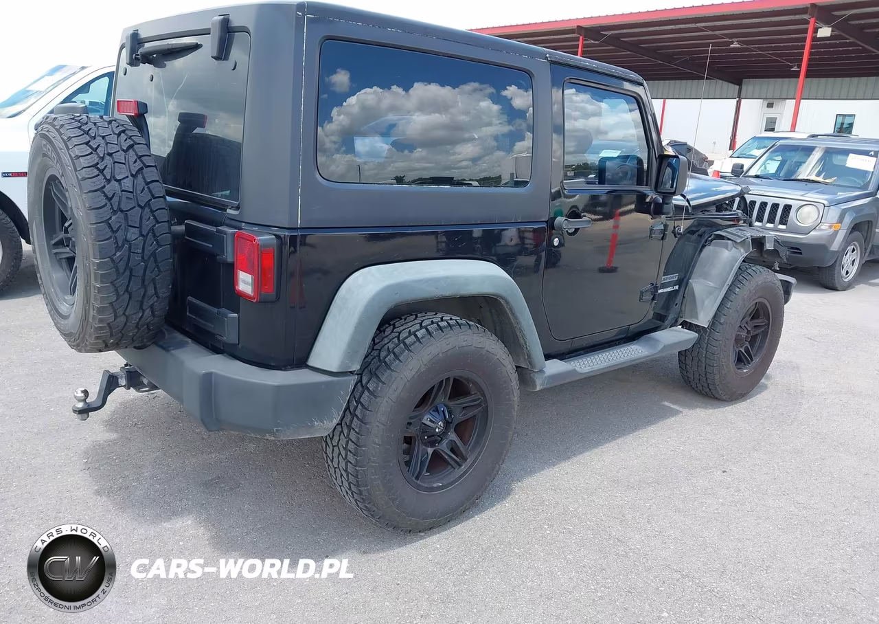 2011 Jeep Wrangler Sport VIN:1J4AA2D19BL580604 - 4
