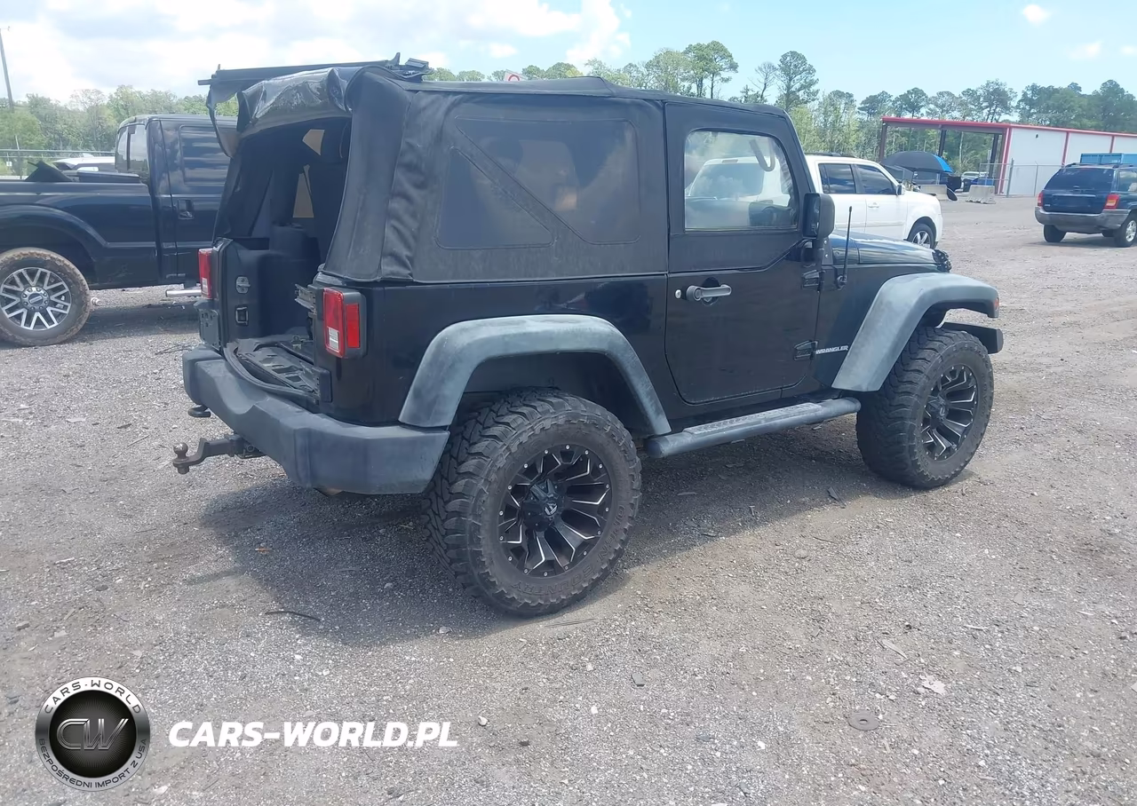2011 Jeep Wrangler Sport VIN:1J4AA2D16BL620430 - 4