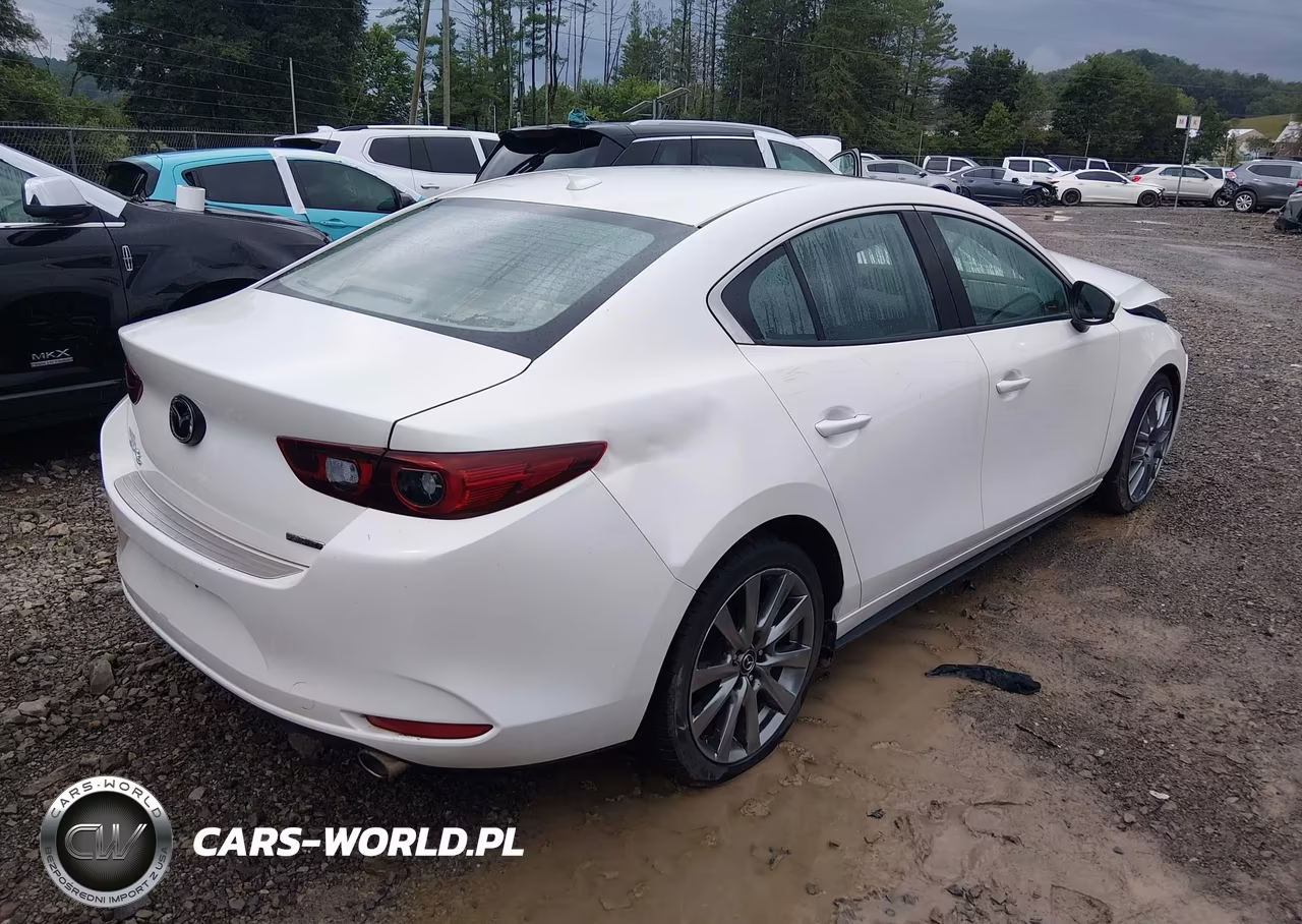2022 Mazda Mazda3 Premium VIN:3MZBPBDL1NM305058 - 4