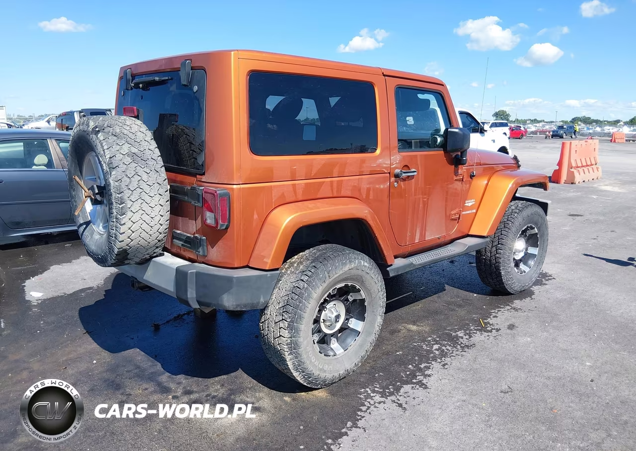 2011 Jeep Wrangler Sahara VIN:1J4AA5D18BL562080 - 4