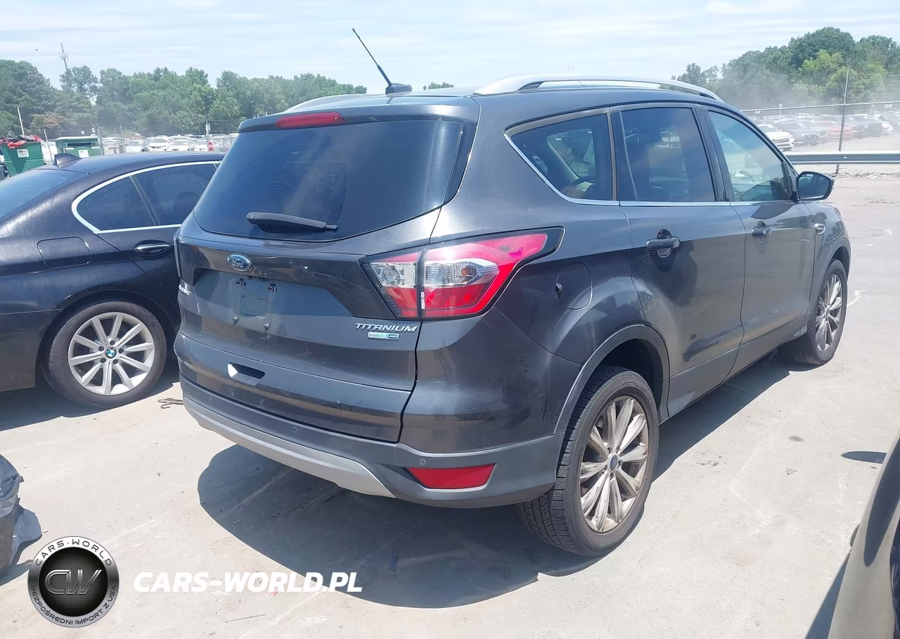 2017 Ford Escape Titanium VIN:1FMCU9J98HUF09577 - 4