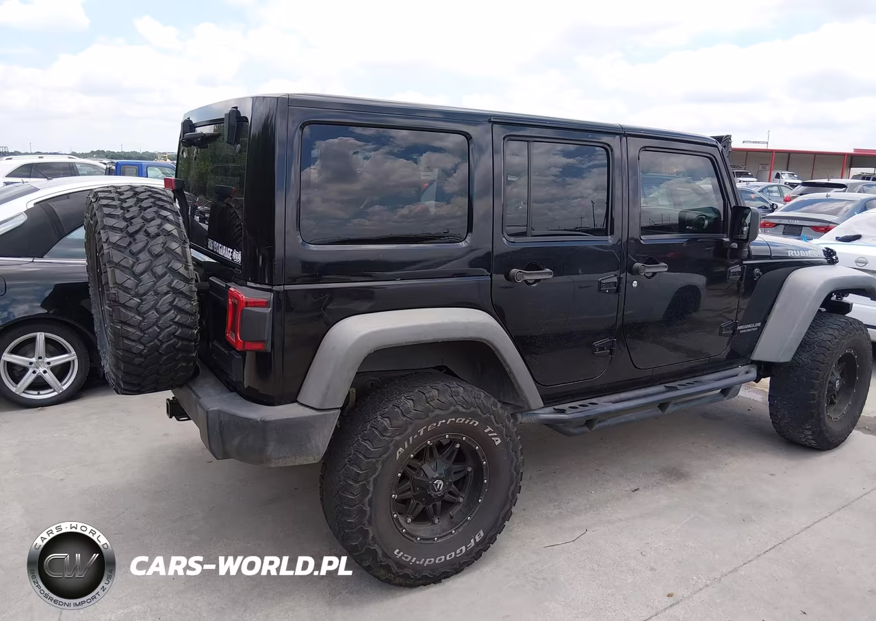 2014 Jeep Wrangler Unlimited Rubicon VIN:1C4BJWFG3EL158111 - 4