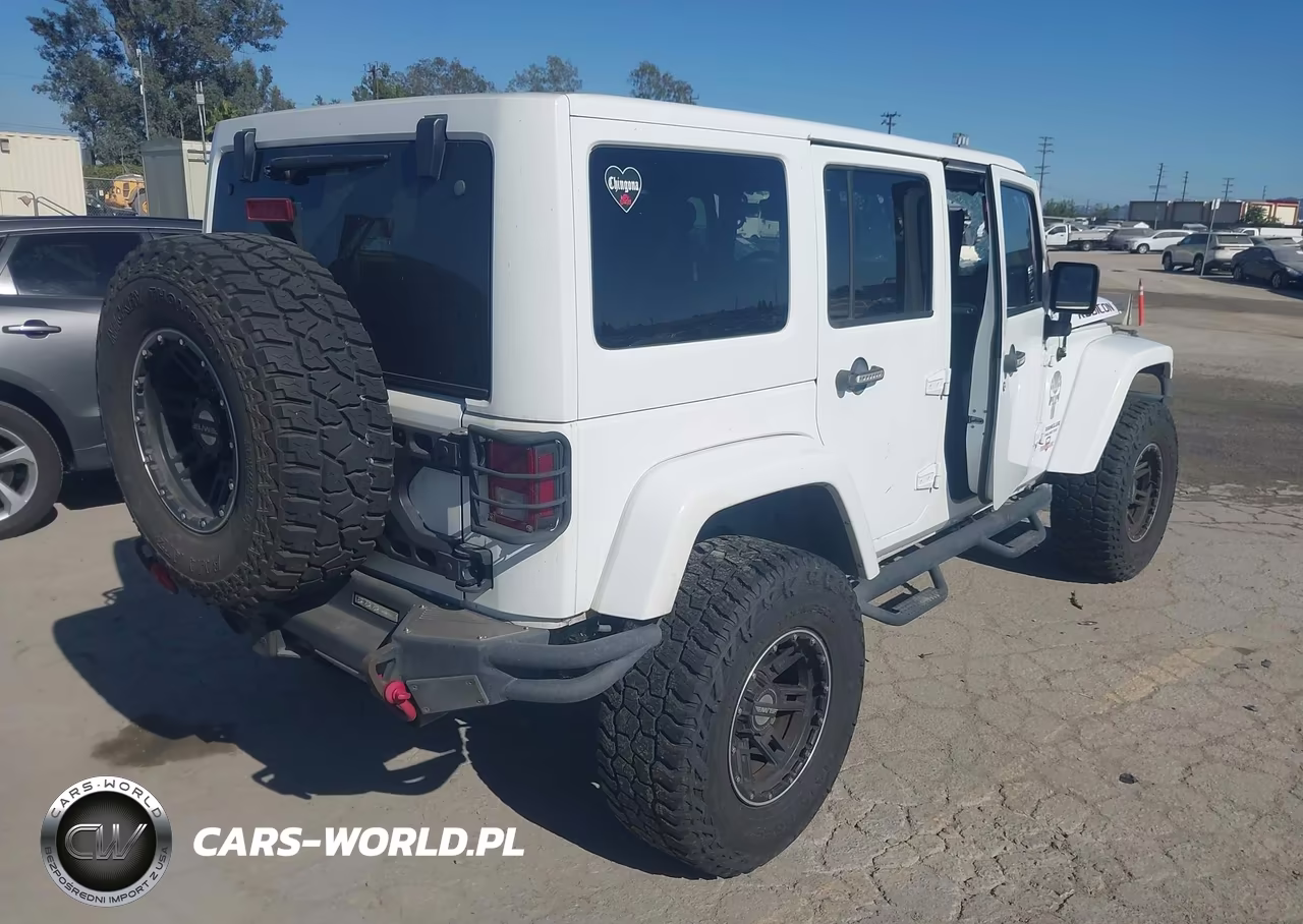 2015 Jeep Wrangler Unlimited Rubicon VIN:1C4BJWFGXFL766564 - 4