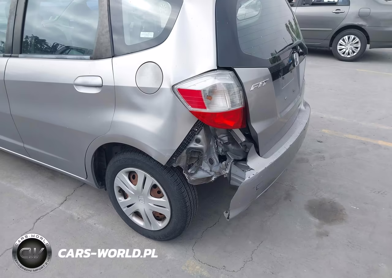 2009 Honda Fit VIN:JHMGE88279C002052 - 6