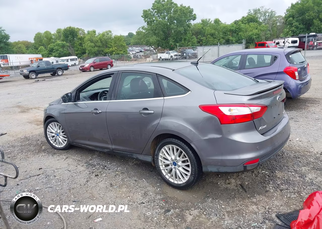 2013 Ford Focus Titanium VIN:1FADP3J27DL128972 - 14