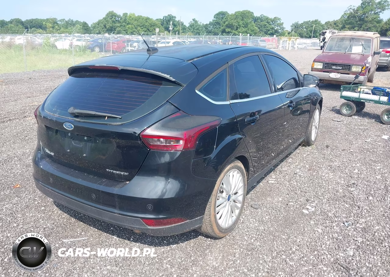 2017 Ford Focus Titanium VIN:1FADP3N25HL221229 - 4