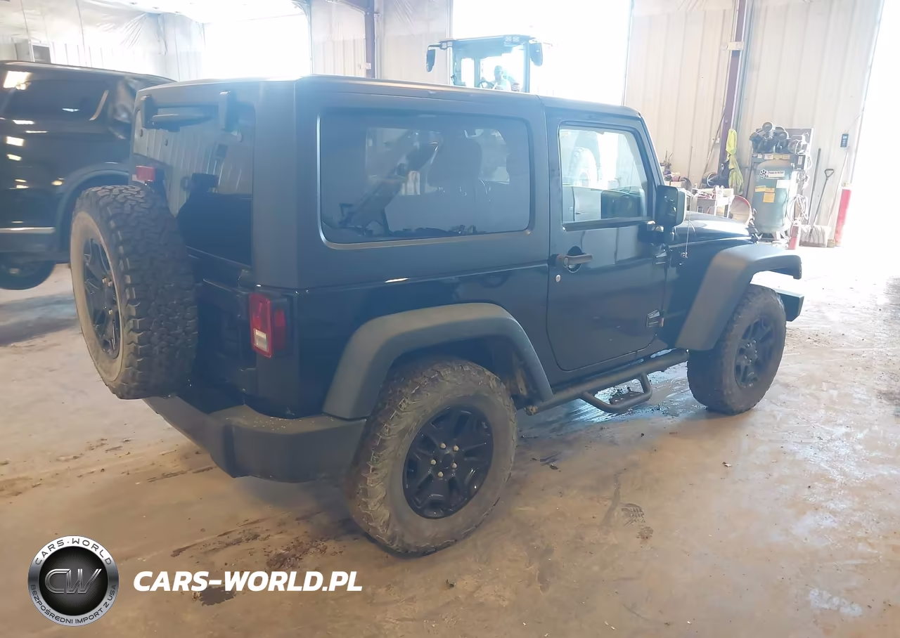 2015 Jeep Wrangler Willys Wheeler VIN:1C4AJWAG6FL565795 - 4