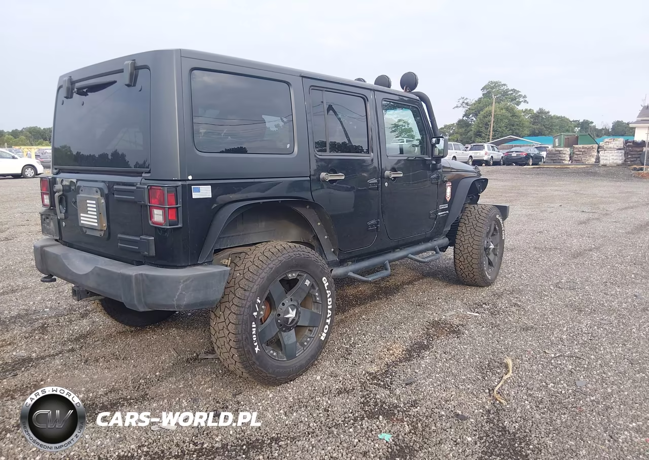 2011 Jeep Wrangler Unlimited Sport VIN:1J4HA3H1XBL610322 - 4