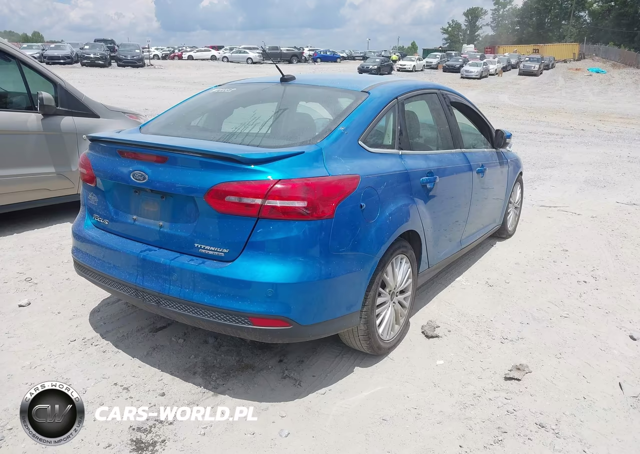 2016 Ford Focus Titanium VIN:1FADP3J24GL242612 - 4
