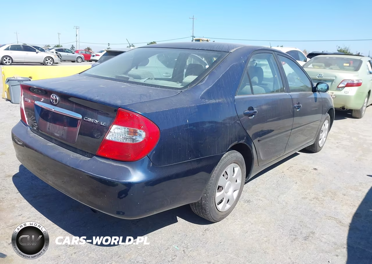 2002 Toyota Camry Le VIN:JTDBE32K120124954 - 4