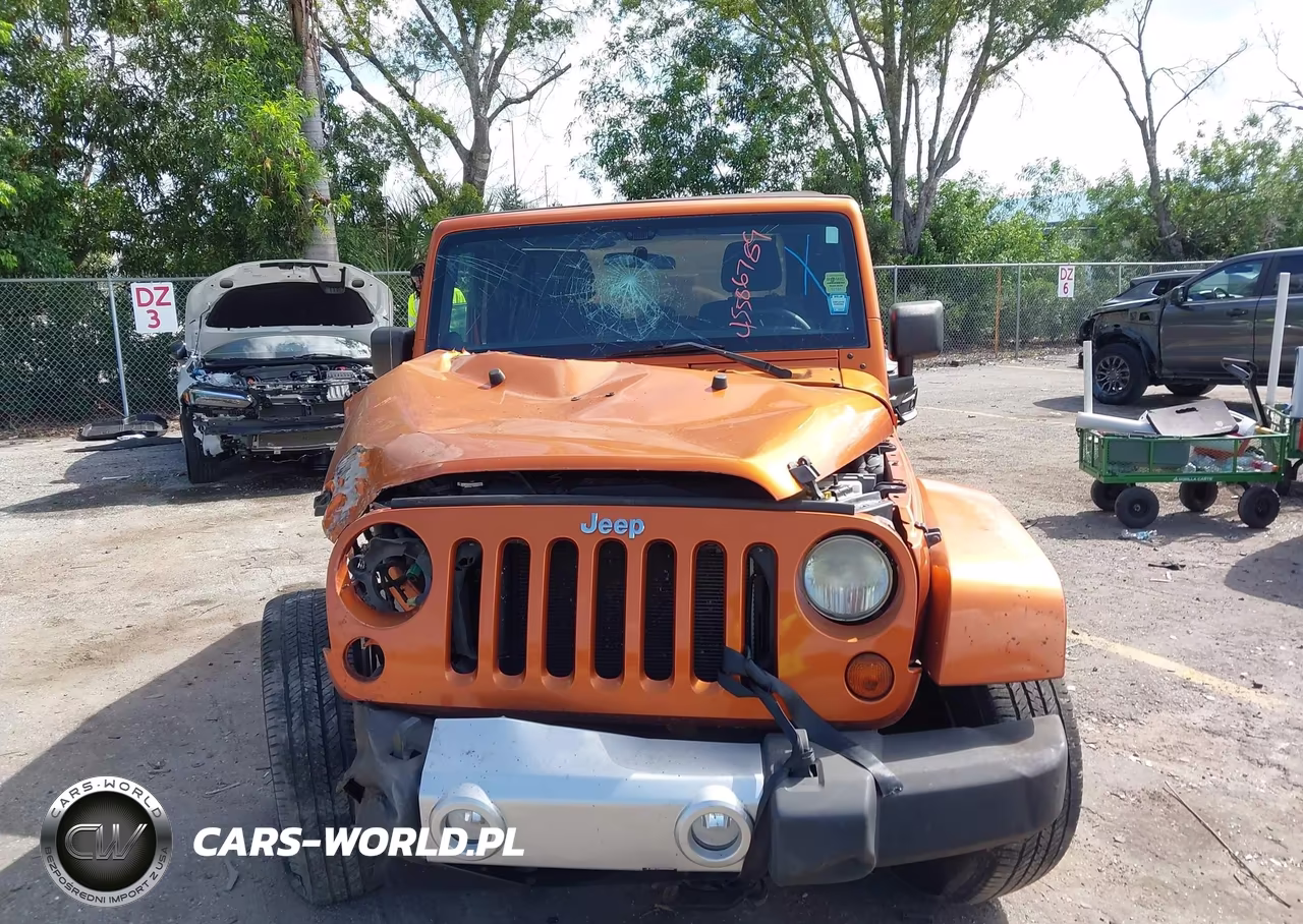 2011 Jeep Wrangler Sahara VIN:1J4AA5D16BL606349 - 12