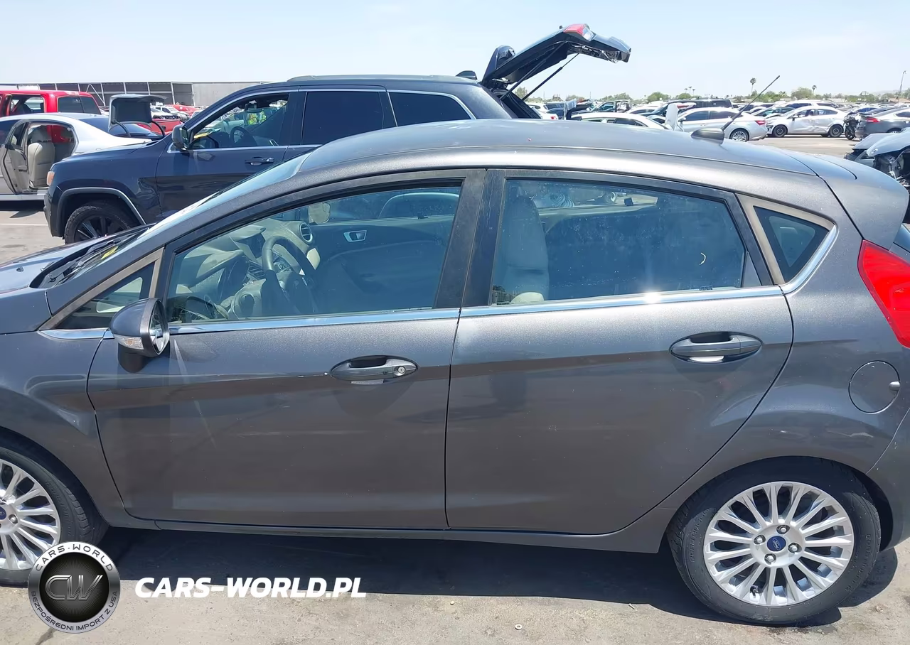 2015 Ford Fiesta Titanium VIN:3FADP4FJ5FM110297 - 14