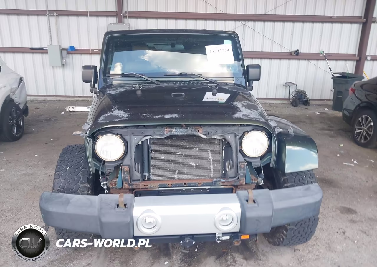 2011 Jeep Wrangler Sahara VIN:1J4AA5D18BL506561 - 12