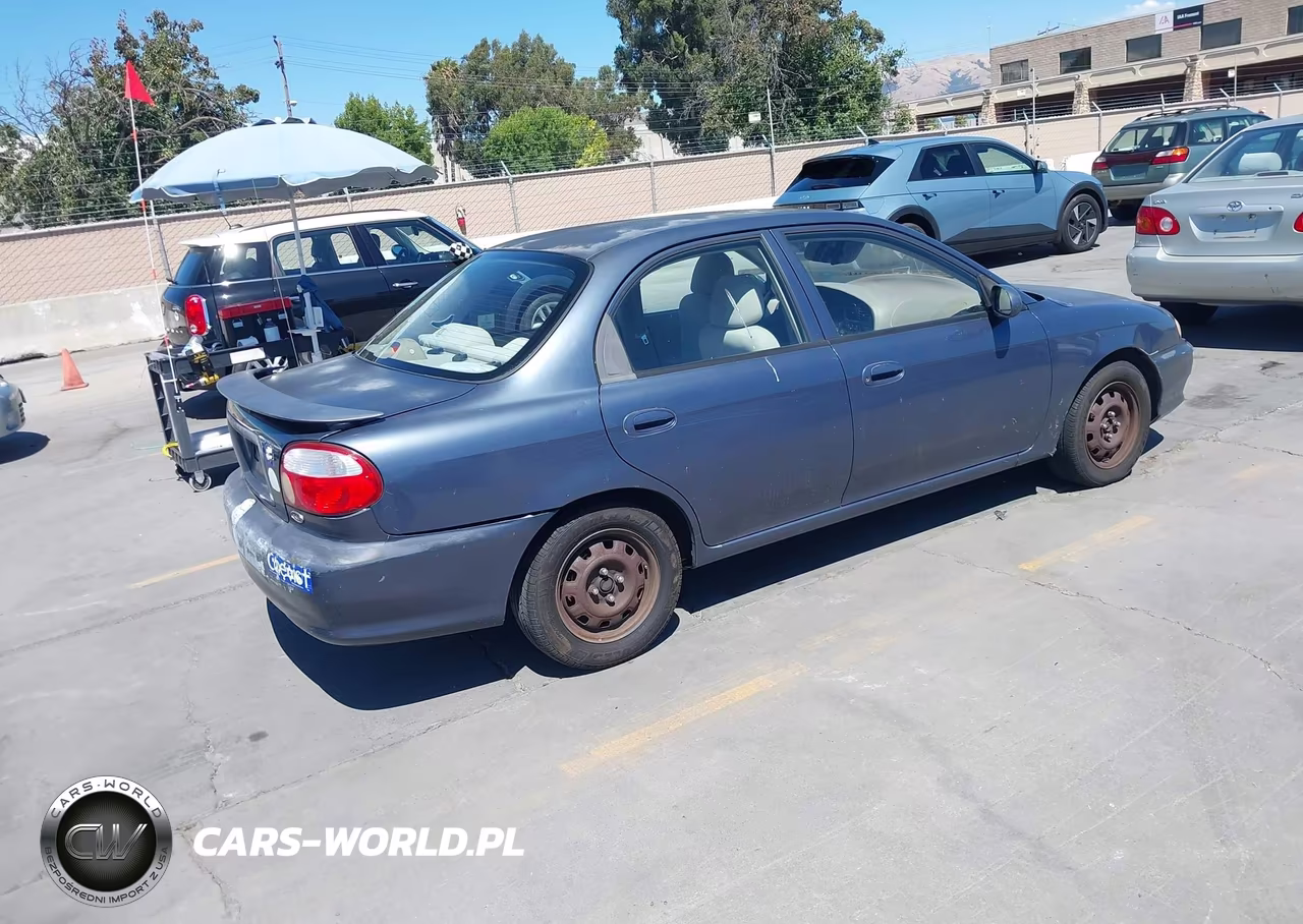 2001 Kia Sephia Ls VIN:KNAFB121X15080974 - 4
