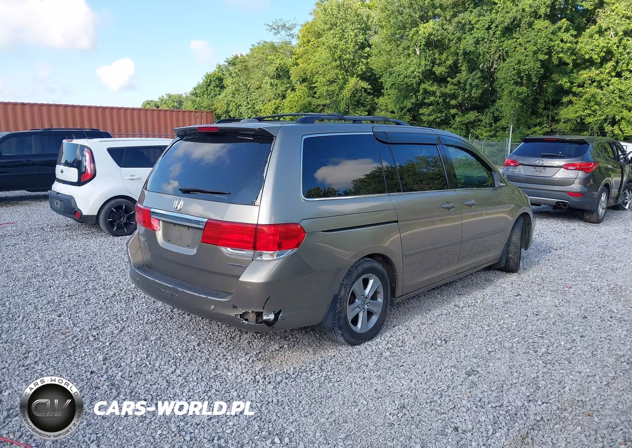 2010 Honda Odyssey Touring VIN:5FNRL3H91AB065123 - 4