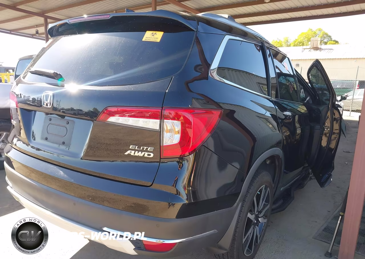 2019 Honda Pilot Elite VIN:5FNYF6H04KB053104 - 4