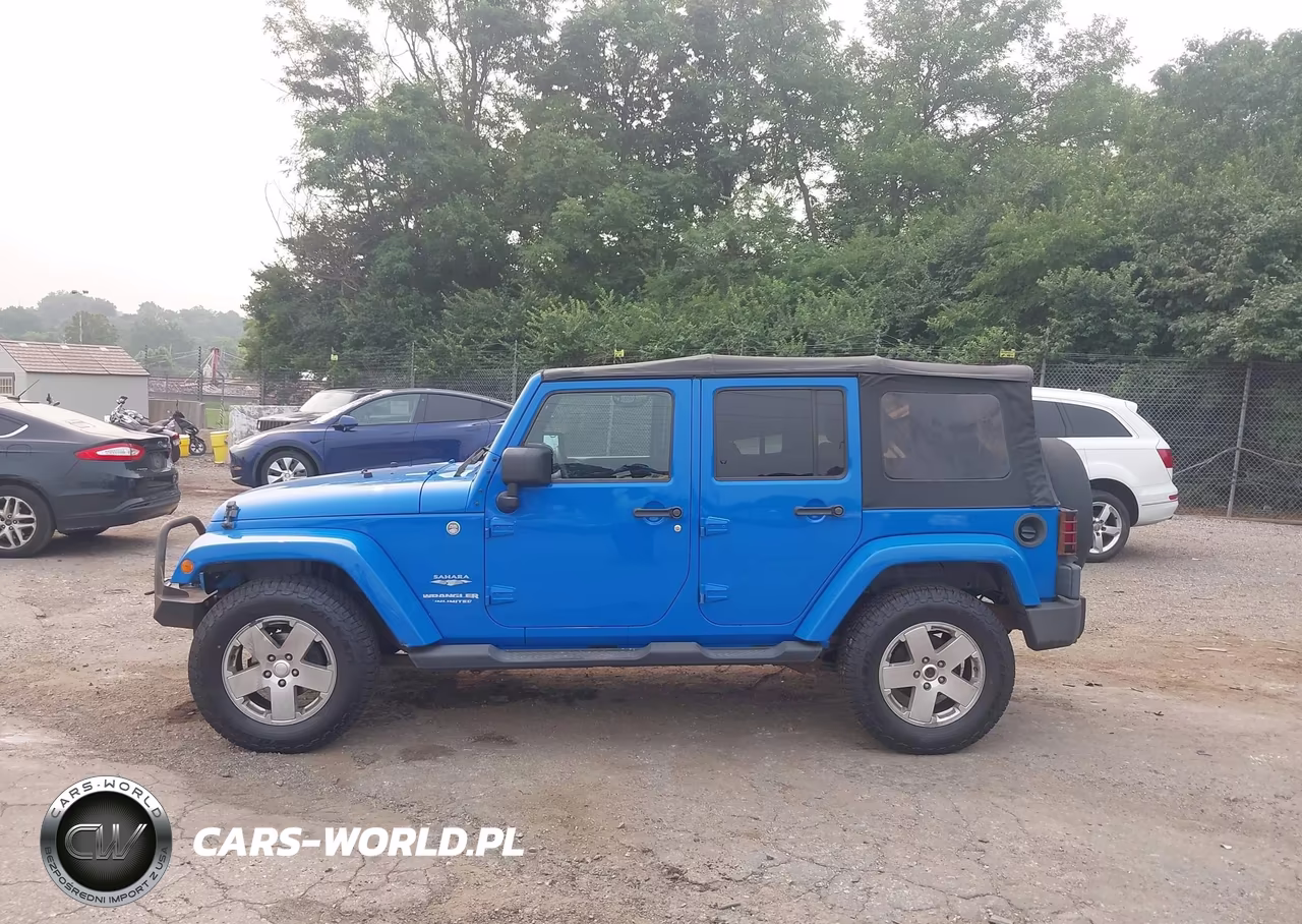 2011 Jeep Wrangler Unlimited Sahara VIN:1J4BA5H11BL563361 - 14
