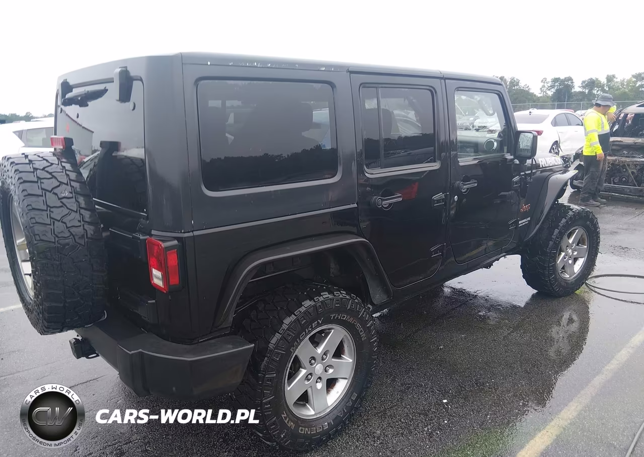 2012 Jeep Wrangler Unlimited Rubicon VIN:1C4BJWFG5CL108064 - 4