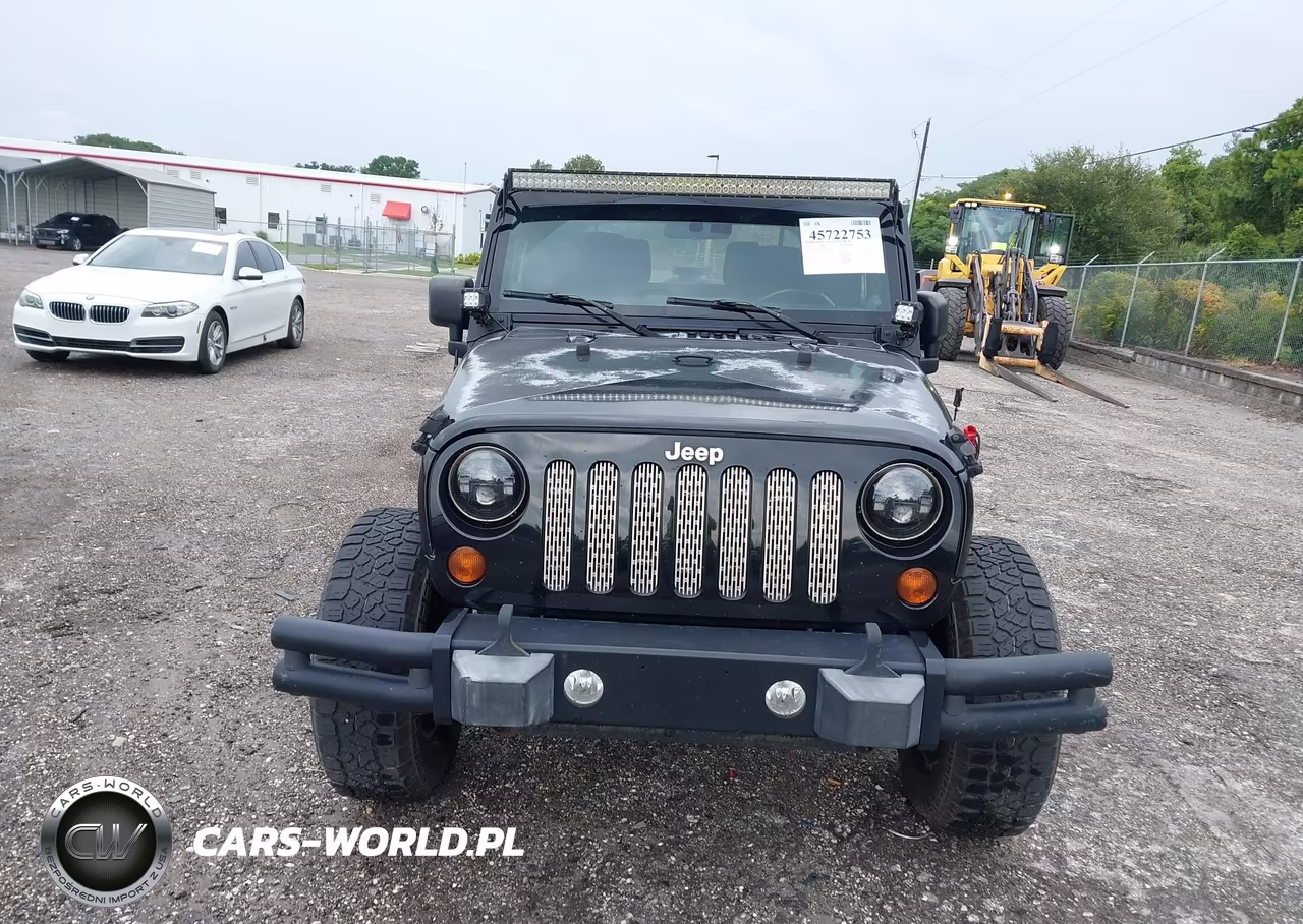 2011 Jeep Wrangler Sport VIN:1J4AA2D12BL579570 - 12