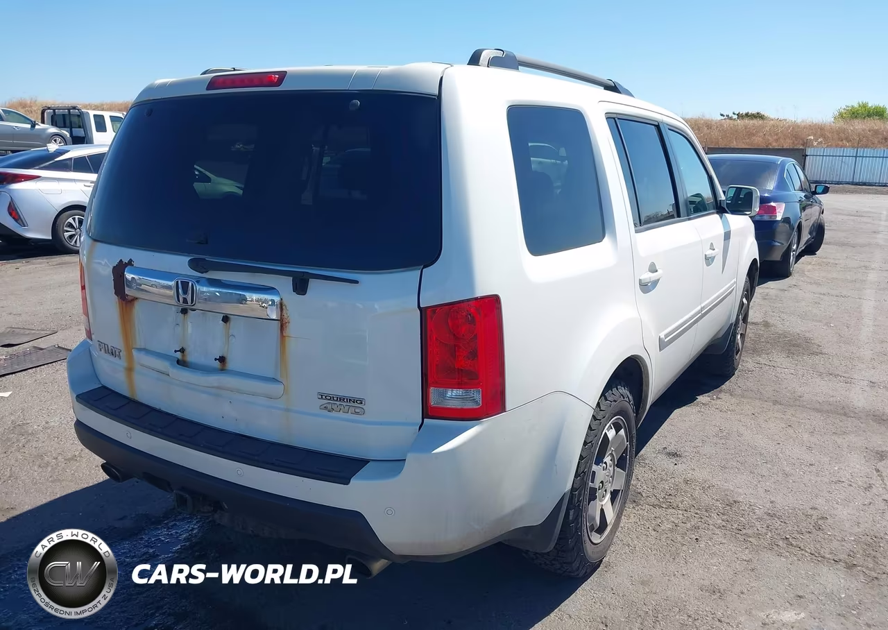 2011 Honda Pilot Touring VIN:5FNYF4H90BB024878 - 4