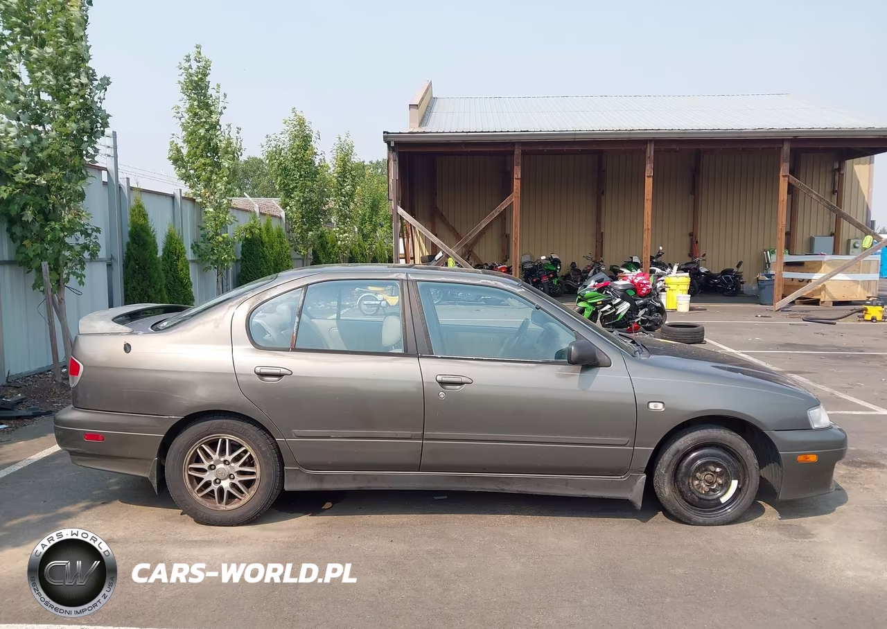 2001 Infiniti G20 Luxury VIN:JNKCP11A71T406667 - 13