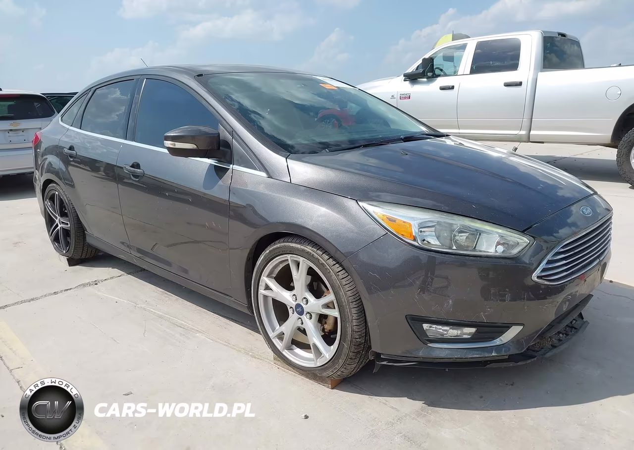 2015 Ford Focus Titanium VIN:1FADP3J28FL334031 - 1