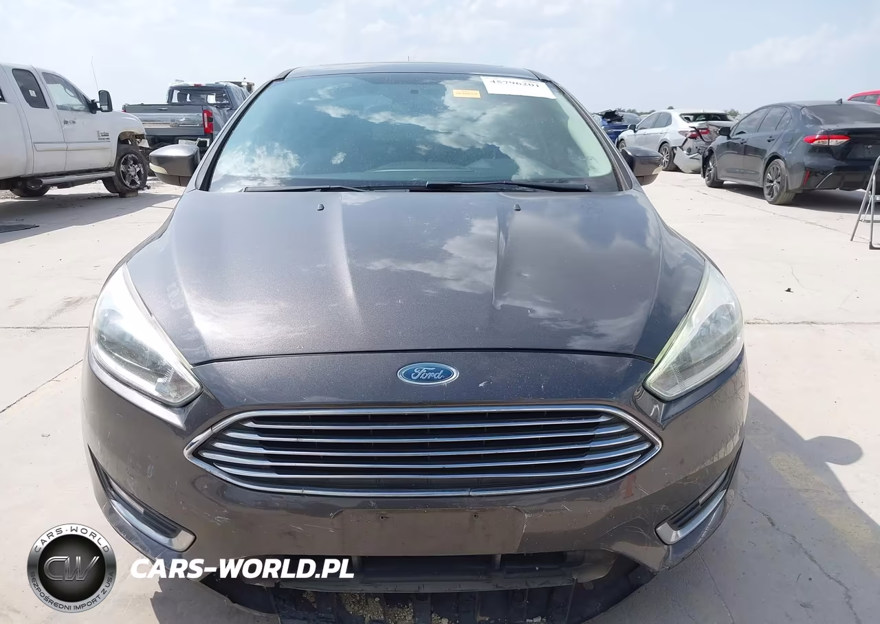 2015 Ford Focus Titanium VIN:1FADP3J28FL334031 - 13