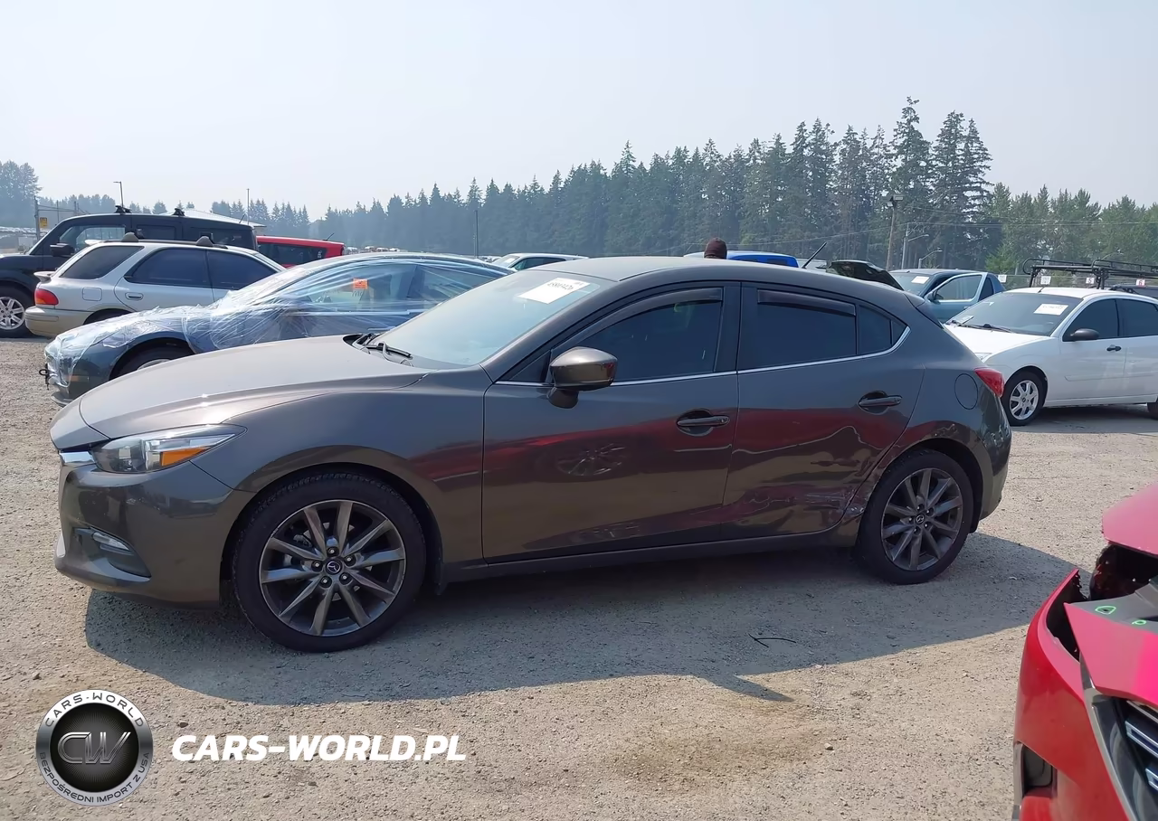 2018 Mazda Mazda3 Touring VIN:3MZBN1L30JM194224 - 14