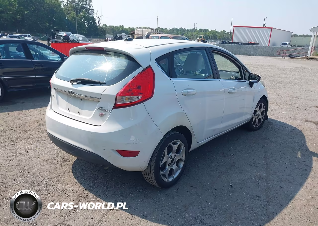 2011 Ford Fiesta Ses VIN:3FADP4FJ3BM124693 - 4
