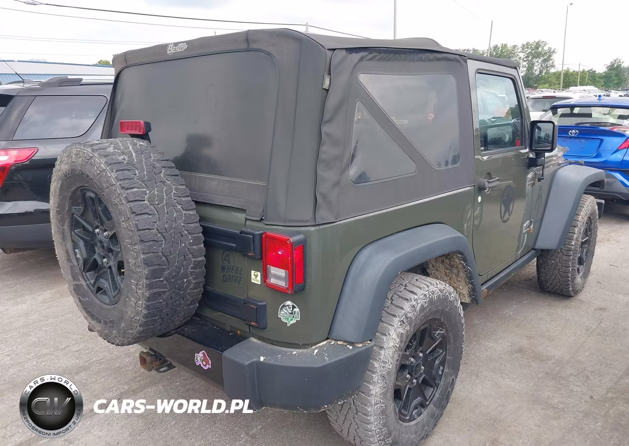 2015 Jeep Wrangler Willys Wheeler VIN:1C4AJWAG9FL592635 - 4