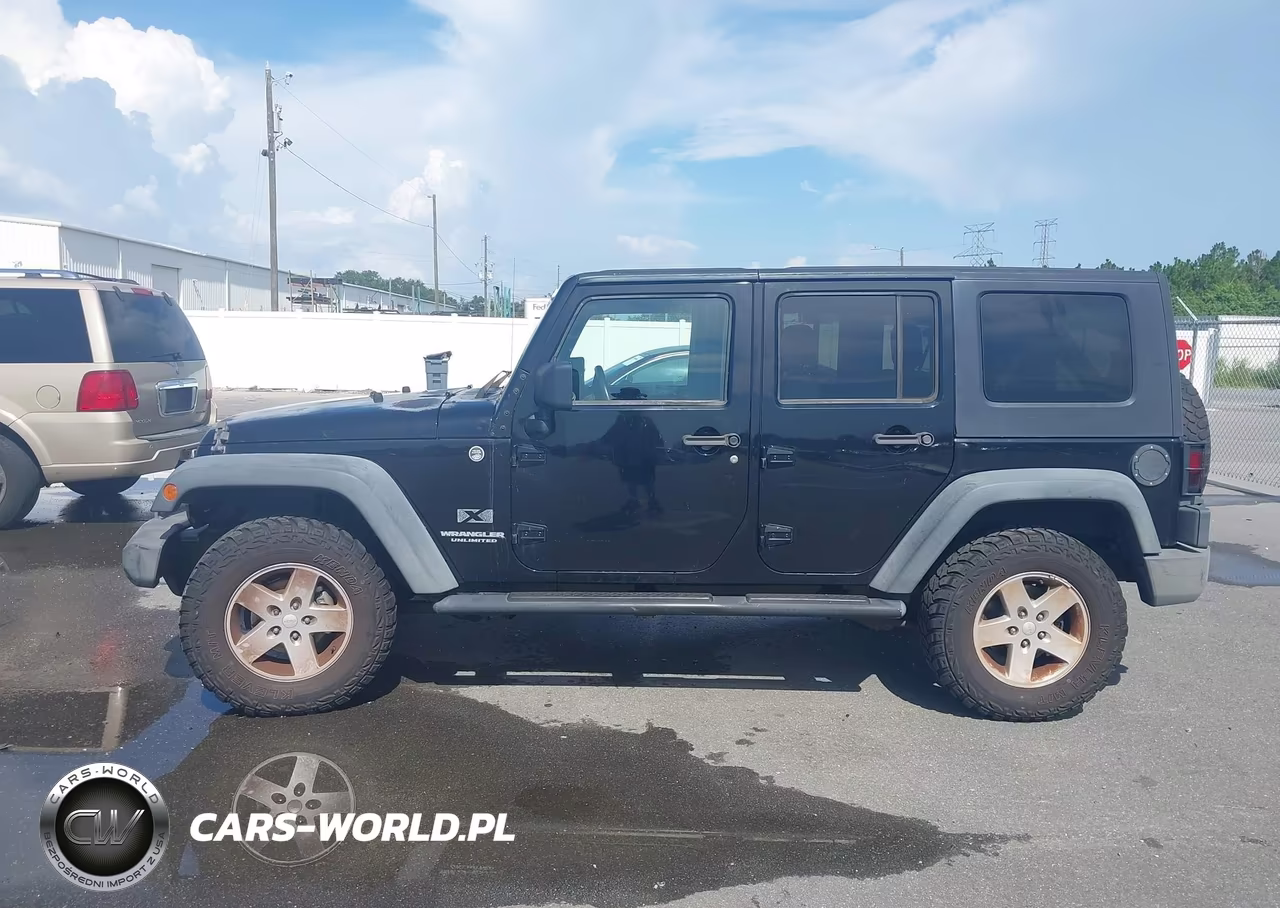 2009 Jeep Wrangler Unlimited X VIN:1J4GA39179L764278 - 14