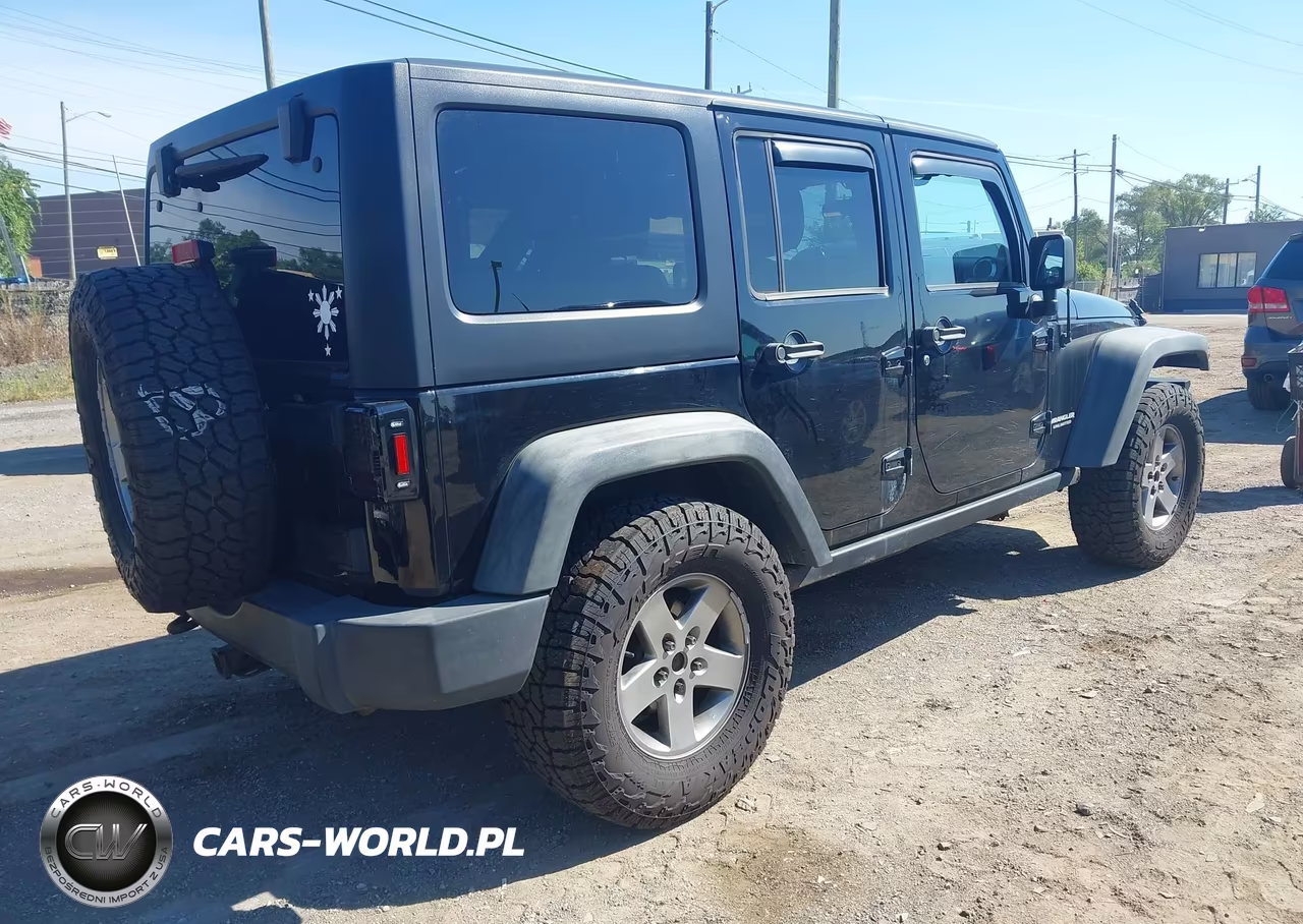 2012 Jeep Wrangler Unlimited Rubicon VIN:1C4BJWFGXCL125331 - 4