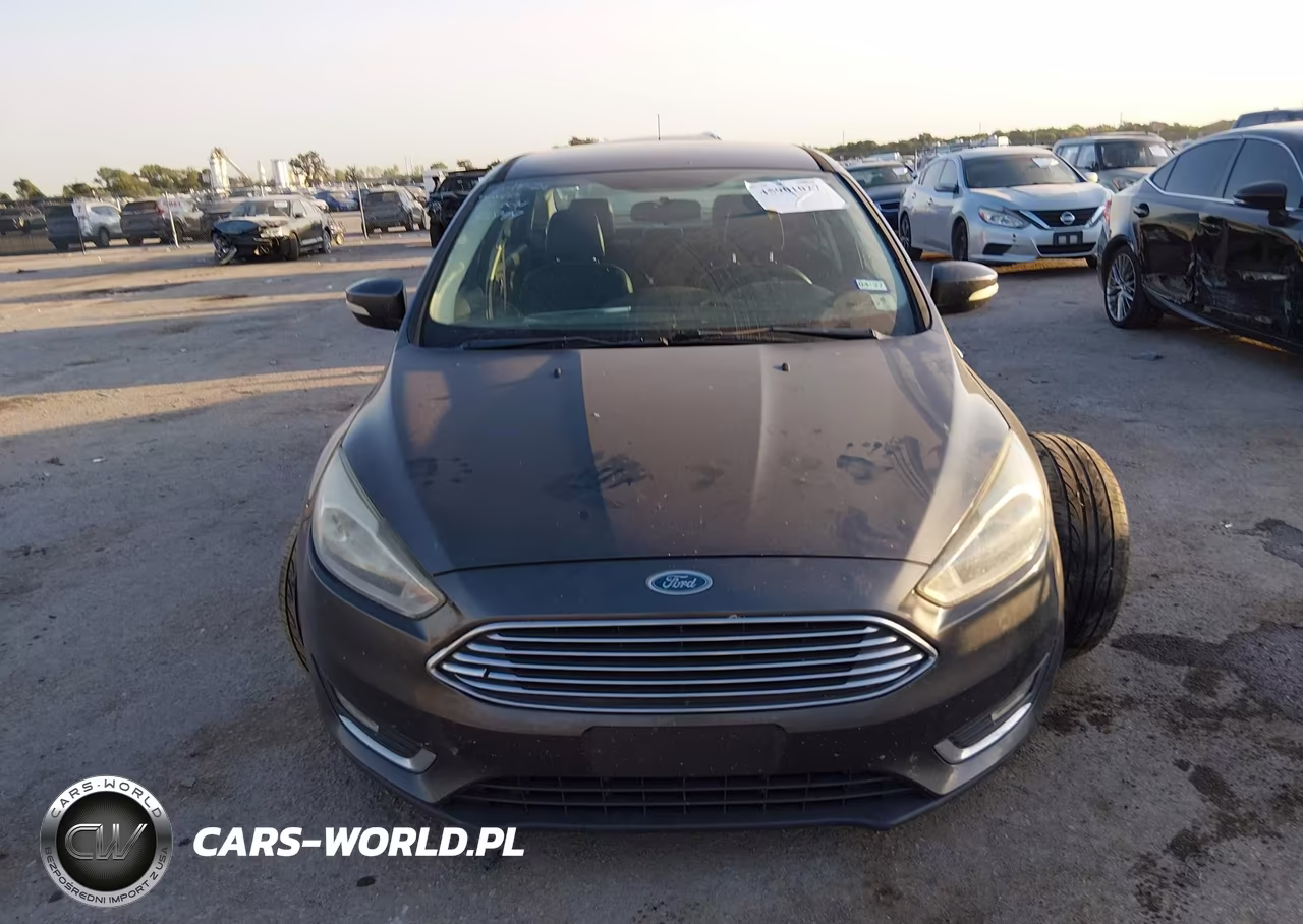 2015 Ford Focus Titanium VIN:1FADP3J22FL370023 - 12