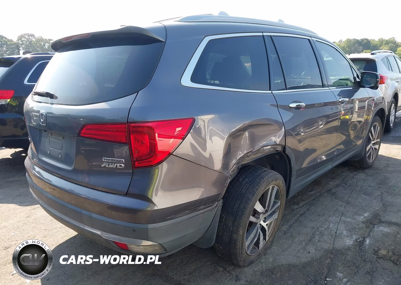 2018 Honda Pilot Touring VIN:5FNYF6H91JB061397 - 4