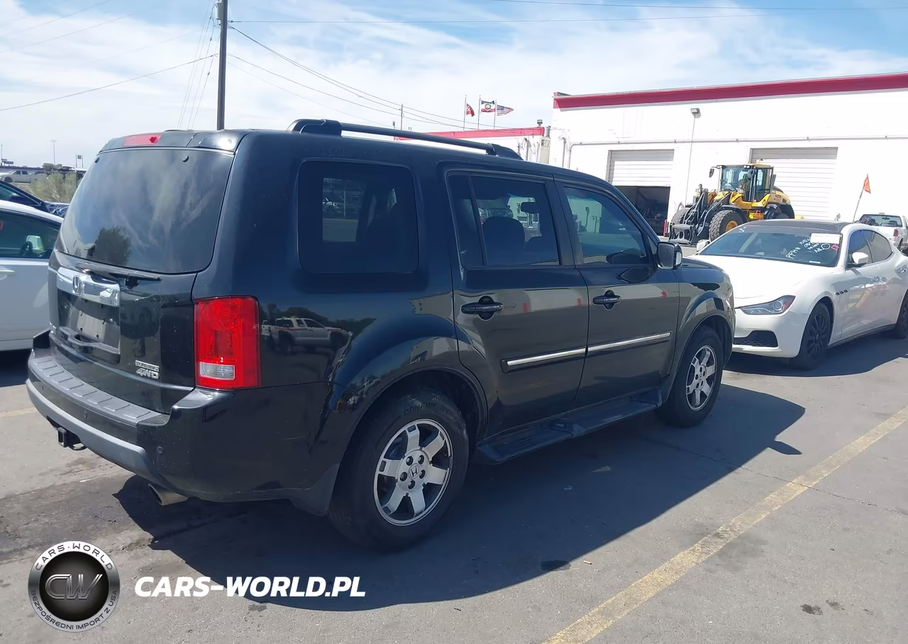 2011 Honda Pilot Touring VIN:5FNYF4H90BB017560 - 4