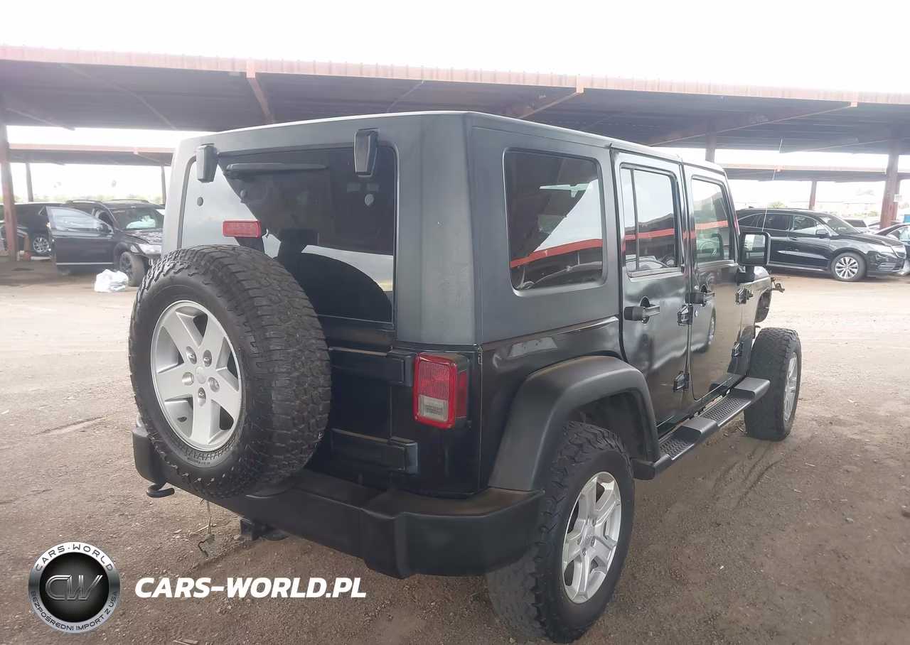 2011 Jeep Wrangler Unlimited Rubicon VIN:1J4BA6H12BL527328 - 4