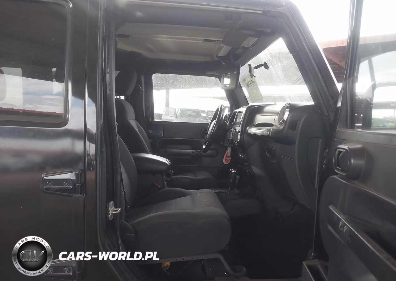 2011 Jeep Wrangler Unlimited Rubicon VIN:1J4BA6H12BL527328 - 5