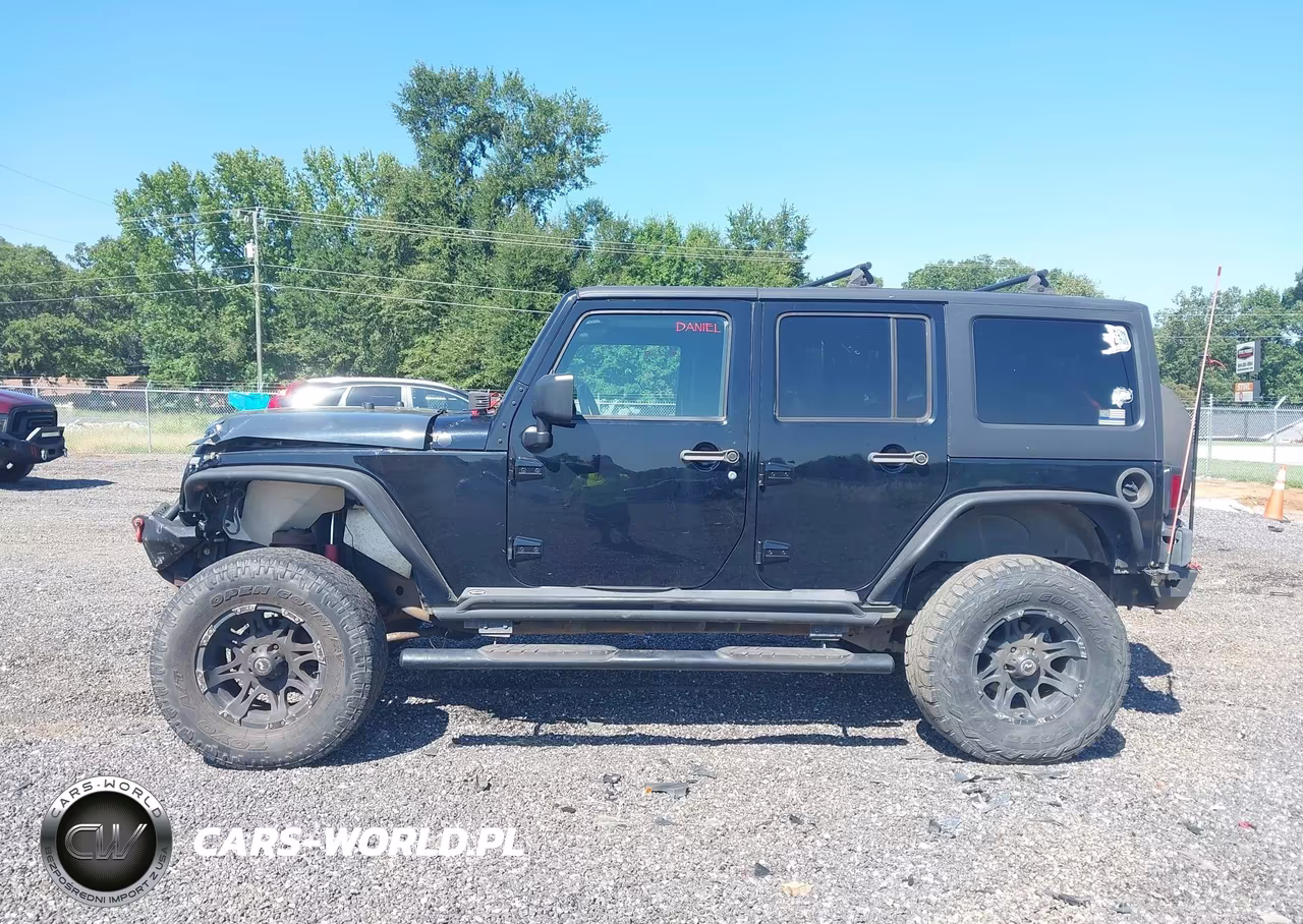 2011 Jeep Wrangler Unlimited Rubicon VIN:1J4BA6H10BL551403 - 14