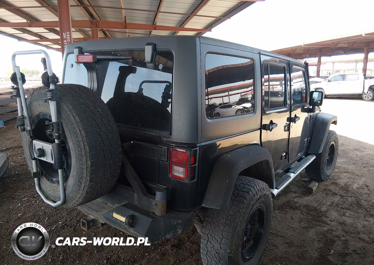 2011 Jeep Wrangler Unlimited Rubicon VIN:1J4BA6H16BL534413 - 4