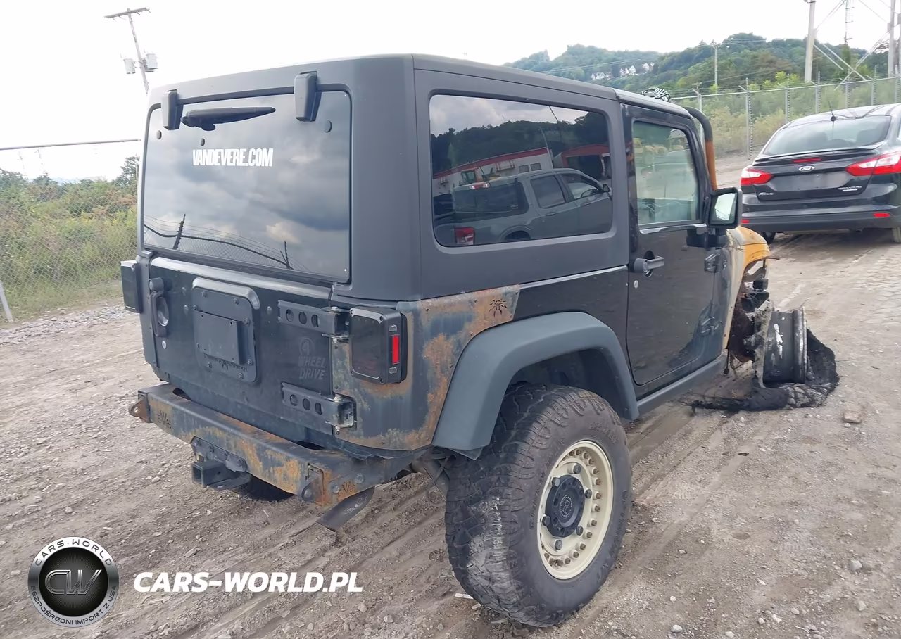 2017 Jeep Wrangler Willys Wheeler VIN:1C4AJWAG7HL553917 - 4