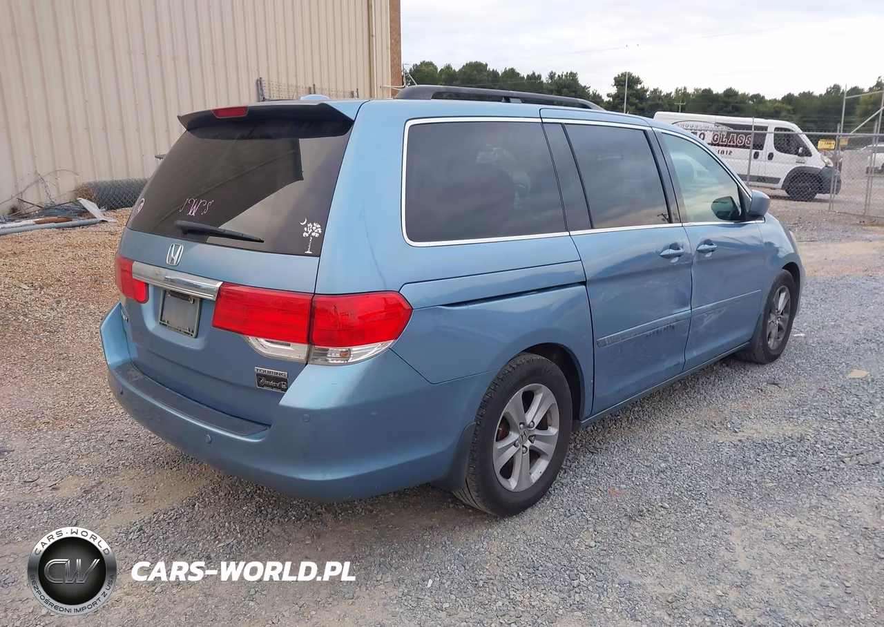 2010 Honda Odyssey Touring VIN:5FNRL3H90AB043727 - 4