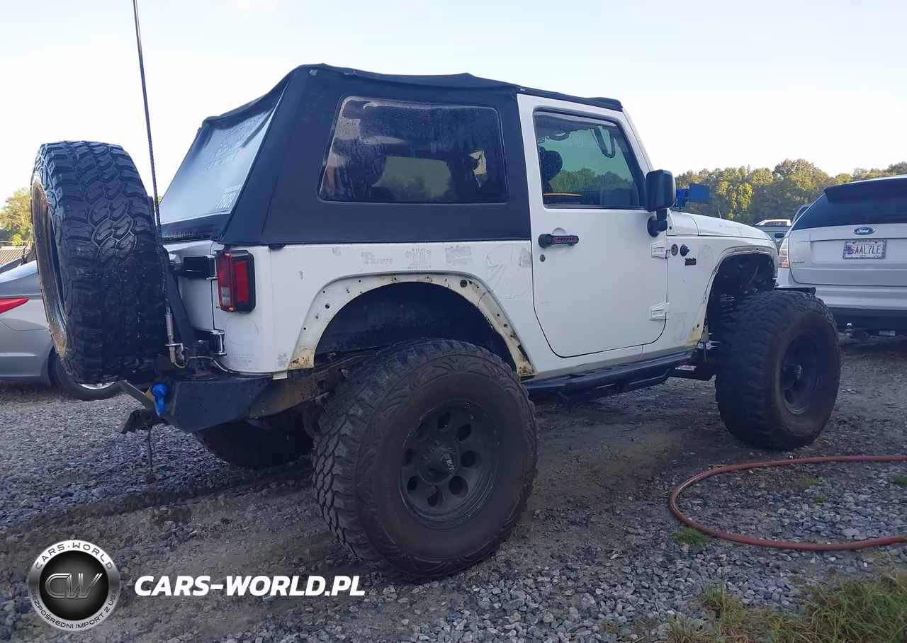 2011 Jeep Wrangler Sport VIN:1J4AA2D14BL620975 - 4