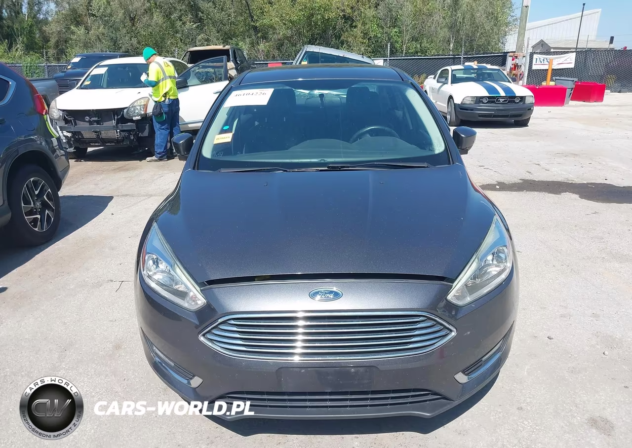 2015 Ford Focus Titanium VIN:1FADP3J28FL323935 - 12